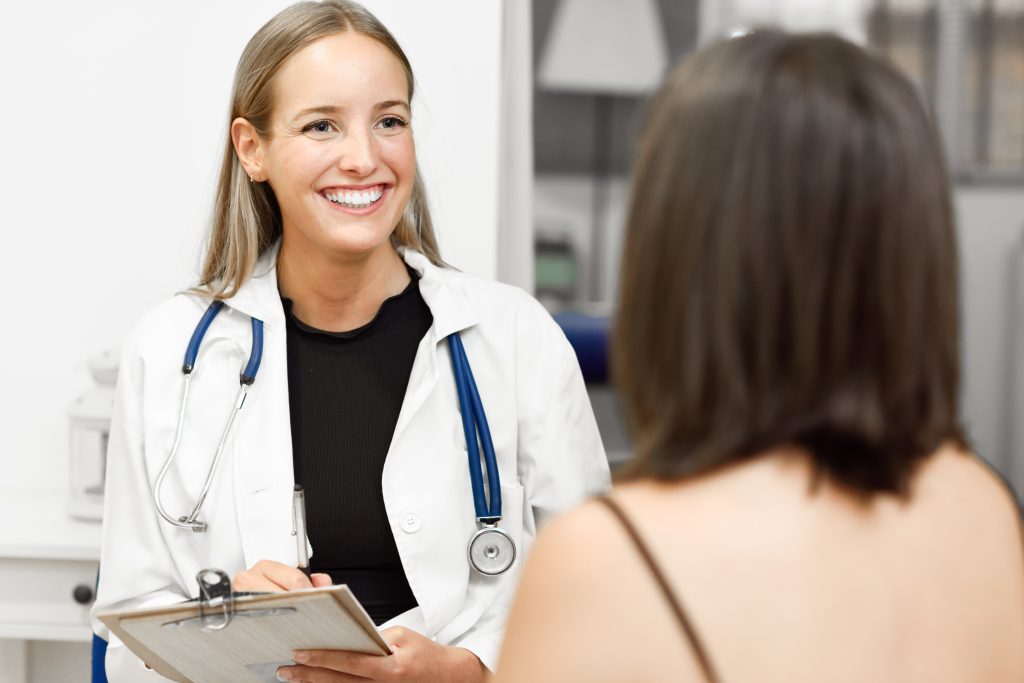 Female medical student smiling.