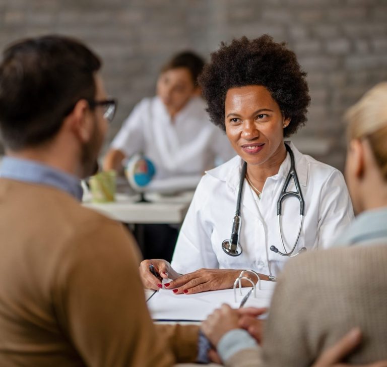 Physician having a conversation with patient